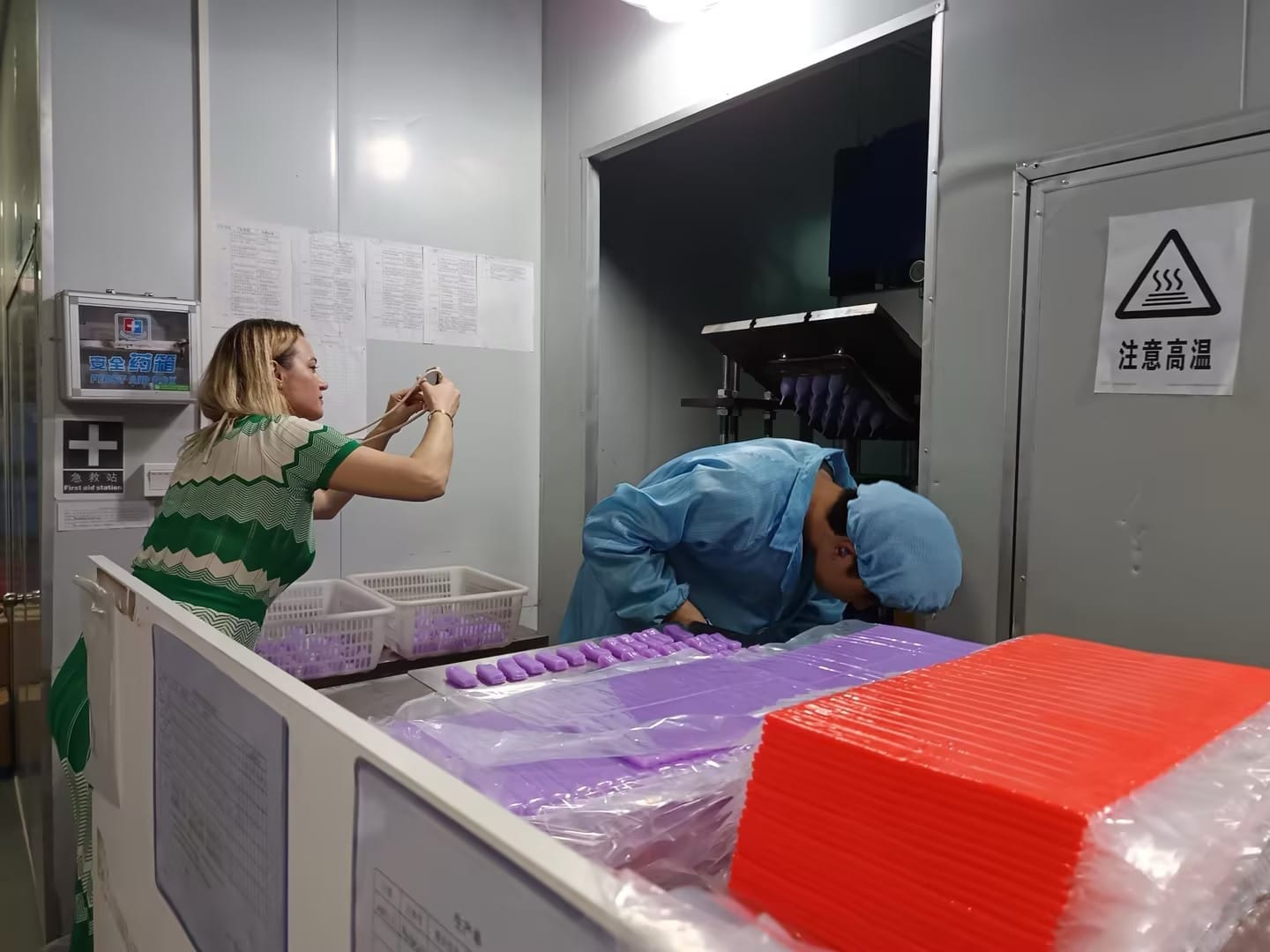 Our Romanian partner documenting menstrual cup and disc production during the factory walkthrough